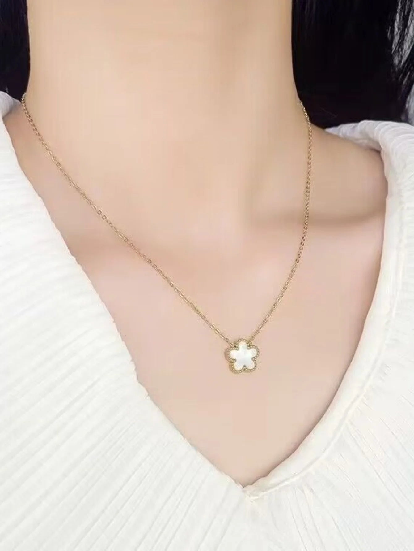 Delicate Clover Pendant (Crafted with intricate details, it adds a touch of sophistication to any outfit
