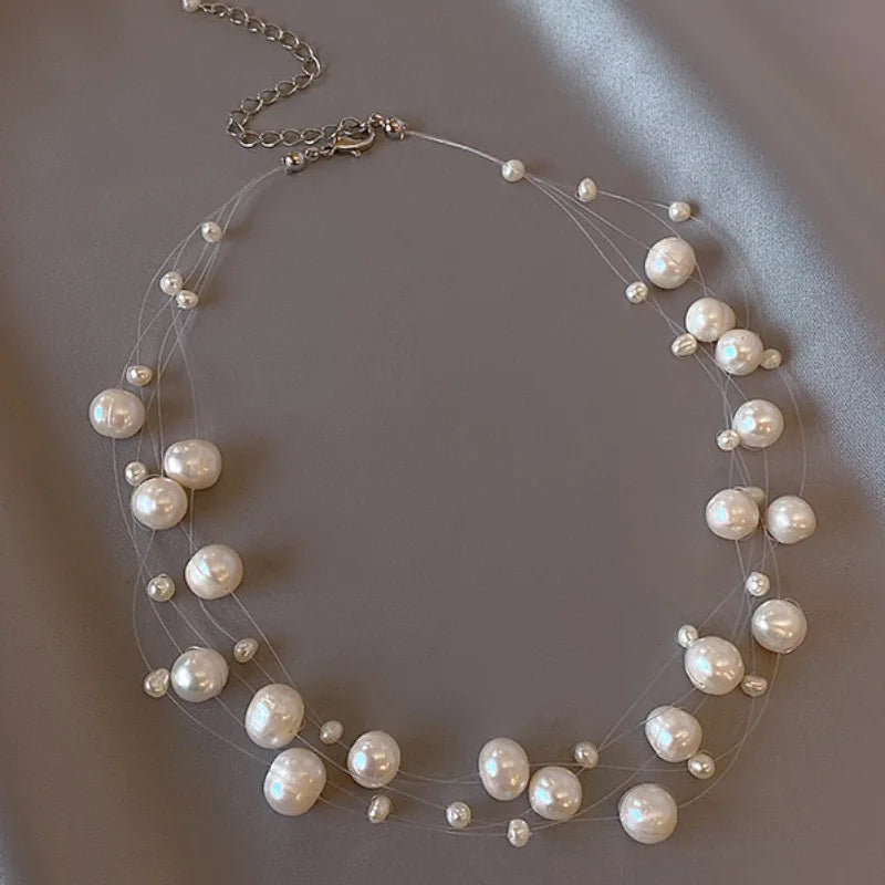 Glory Pearl Choker (Handcrafted with unique pearls, this luxurious piece exudes sophistication and elegance)