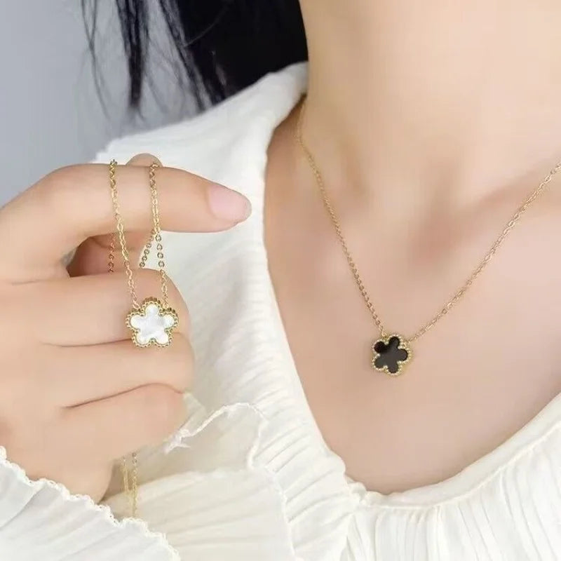 Delicate Clover Pendant (Crafted with intricate details, it adds a touch of sophistication to any outfit