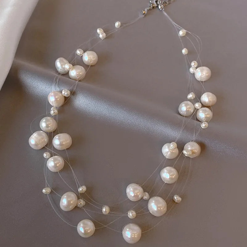 Glory Pearl Choker (Handcrafted with unique pearls, this luxurious piece exudes sophistication and elegance)