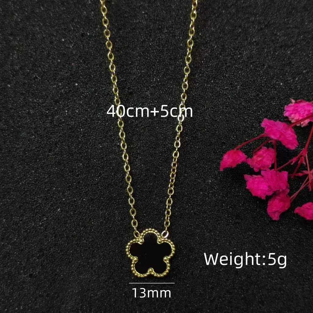 Delicate Clover Pendant (Crafted with intricate details, it adds a touch of sophistication to any outfit